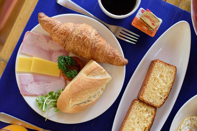 French breakfast with baguette, croissant, ham, cheese and coffee at Siam Lanna Villas