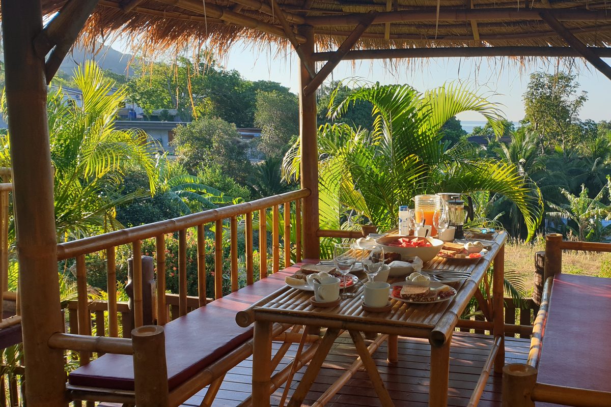 Breakfast table set in the bamboo sala at Siam Lanna Villas