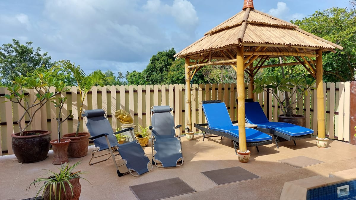 bamboo sala and poolside lounge chairs in the garden — Outdoor area of Villa Ayutthaya, private pool villa in Koh Lanta