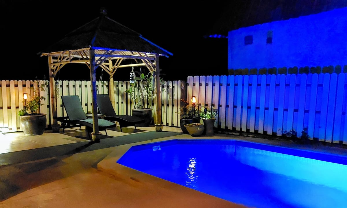 pool and bamboo sala lit up at night — Outdoor area of Villa Ayutthaya, private pool villa in Koh Lanta