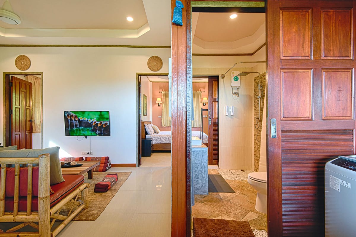 living room and bathroom overview — 2nd floor of Villa Siam Lanna, private pool villa in Koh Lanta