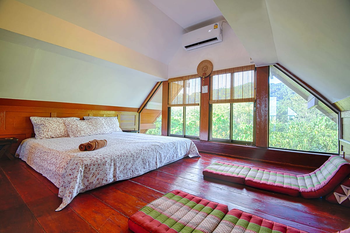 bed and seating — 3rd floor of Villa Siam Lanna, private pool villa in Koh Lanta