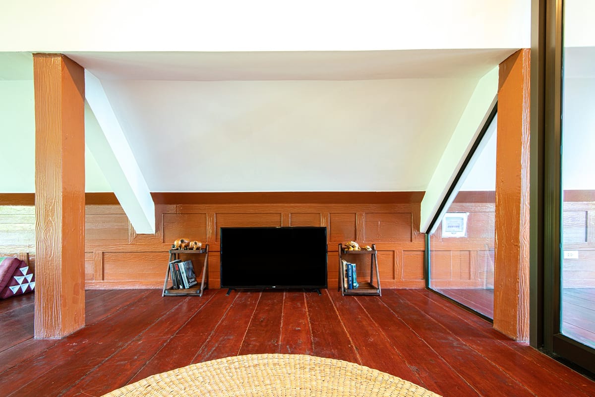 loft TV nook with wooden beams — 3rd floor of Villa Siam Lanna, private pool villa in Koh Lanta