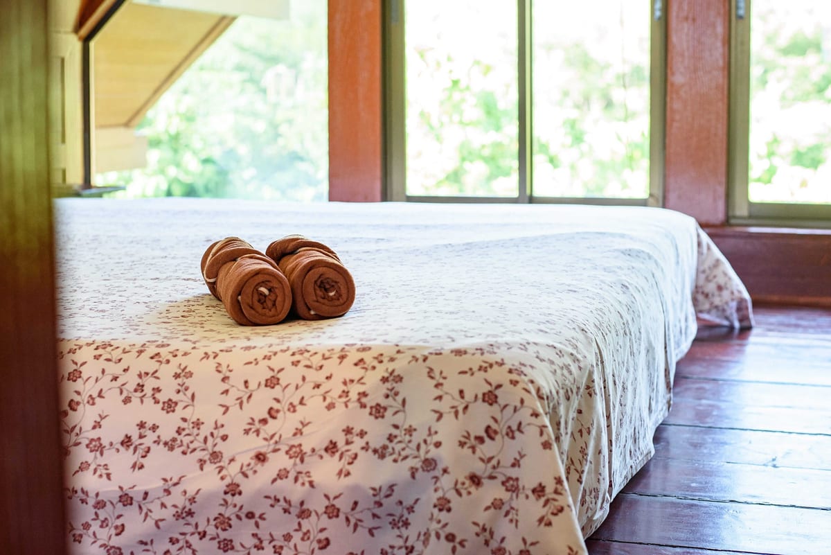 towels on bed — 3rd floor of Villa Siam Lanna, private pool villa in Koh Lanta